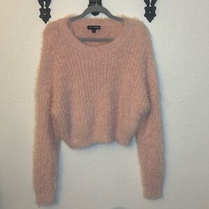 Fuzzy pink Sun & Moon sweaters